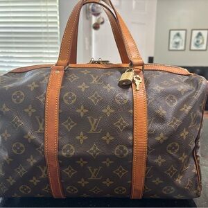 Louis Vuitton Sac Souple 35 with lock, luggage tag and poignant belt